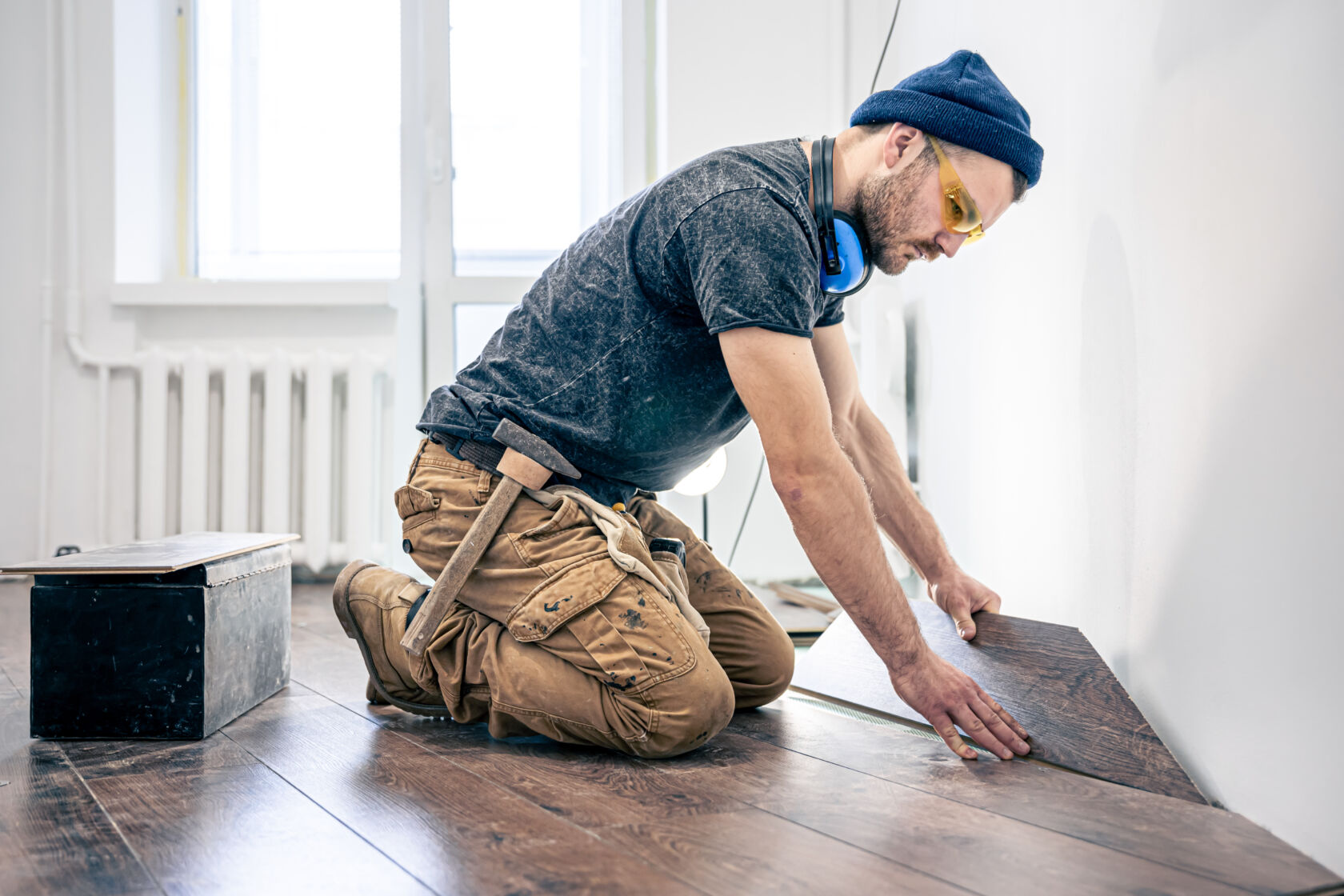 Man Installing Hardwood Flooring