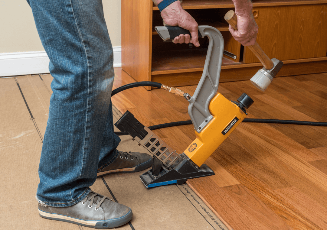 Man Installing Solid Hardwood Flooring