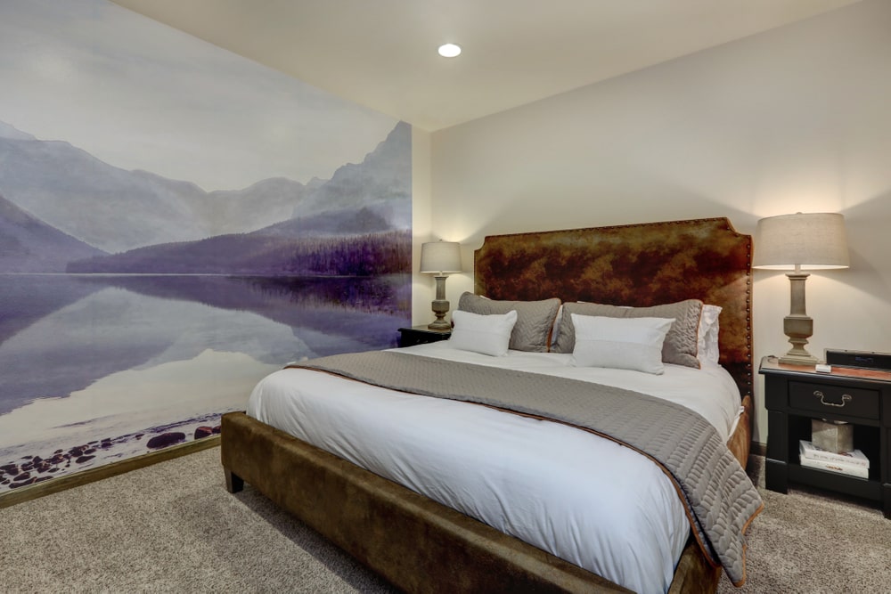 Calm evening cozy guest bedroom with large king size bed calgary flooring store